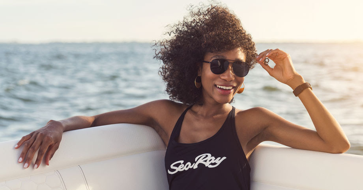 Women in Sea Ray bathing suit on boat