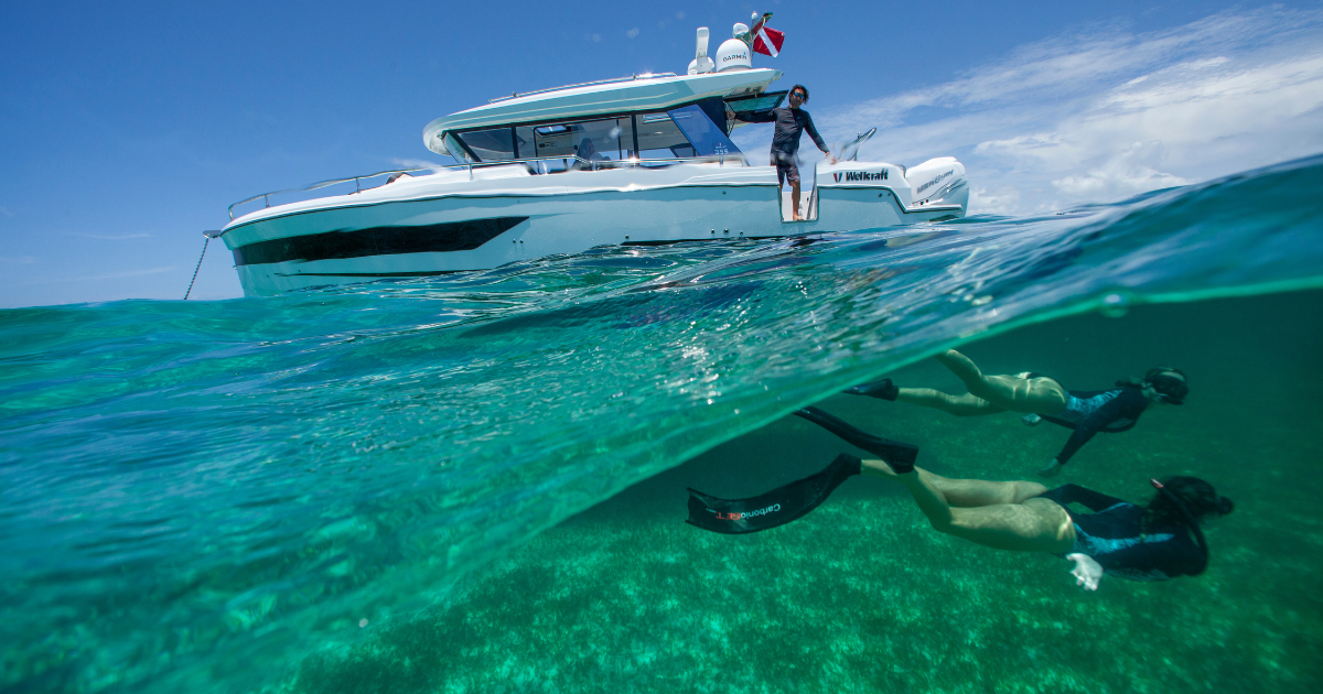 People snorkeling off of the Wellcraft 355